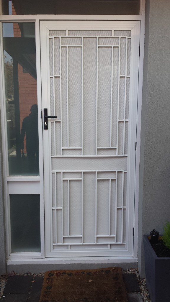 Decorative Grille door in Pearl White powdercoat.