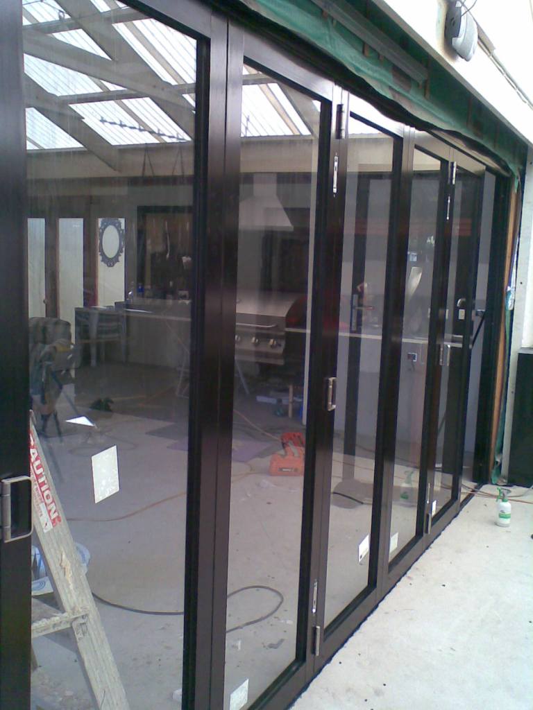 Black Aluminium Bifold doors for internal dividing room
