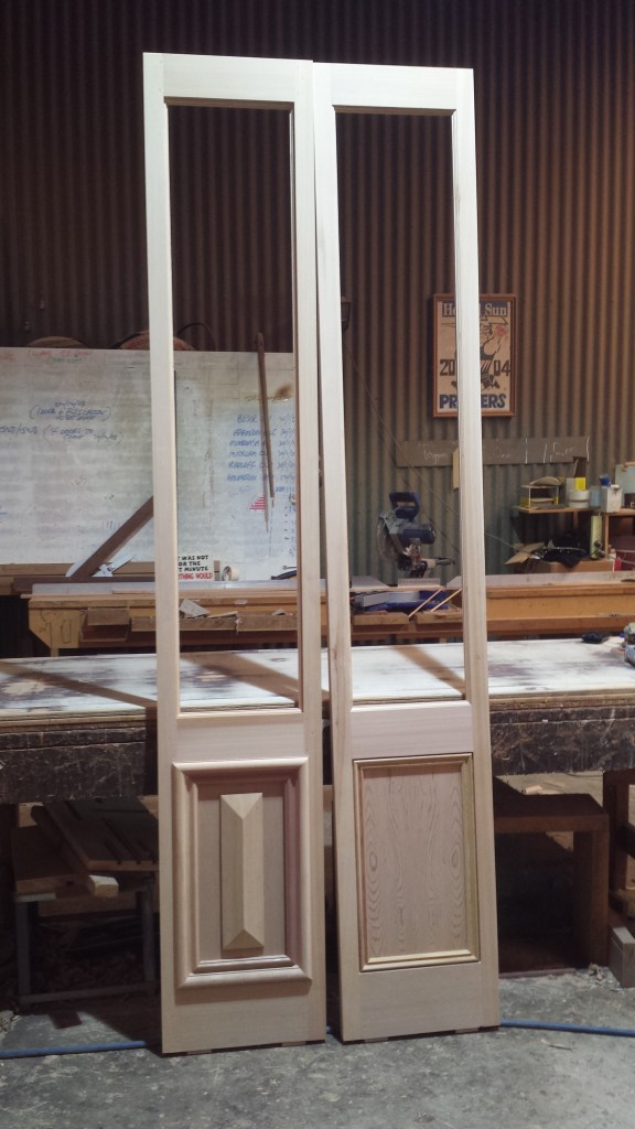 French doors with paneling.  Western red cedar