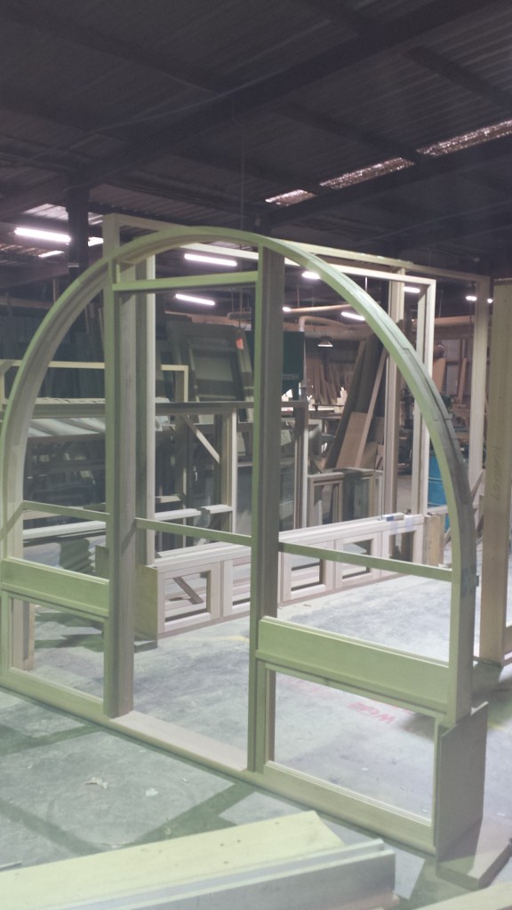 Arched doorframe with awning sidelites. 