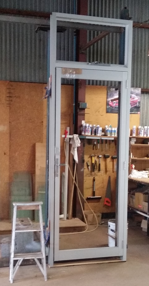 Clear anodise commercial frame with hinged door and awning hilite