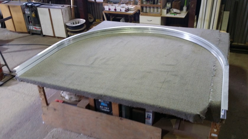 Here is mill (raw) alumimium commercial frame we have engineered to a curve. we will then make a window from it.