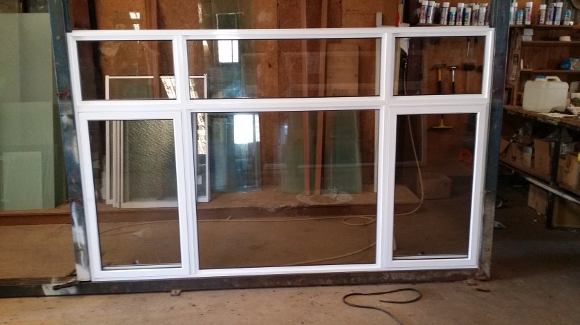 white aluminium awning window with clear glass, flyscreens and lockable winders.