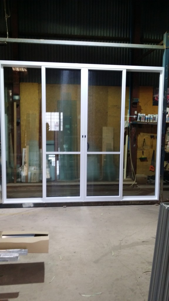 2525 high x 2995 wide white aluminium sliding door