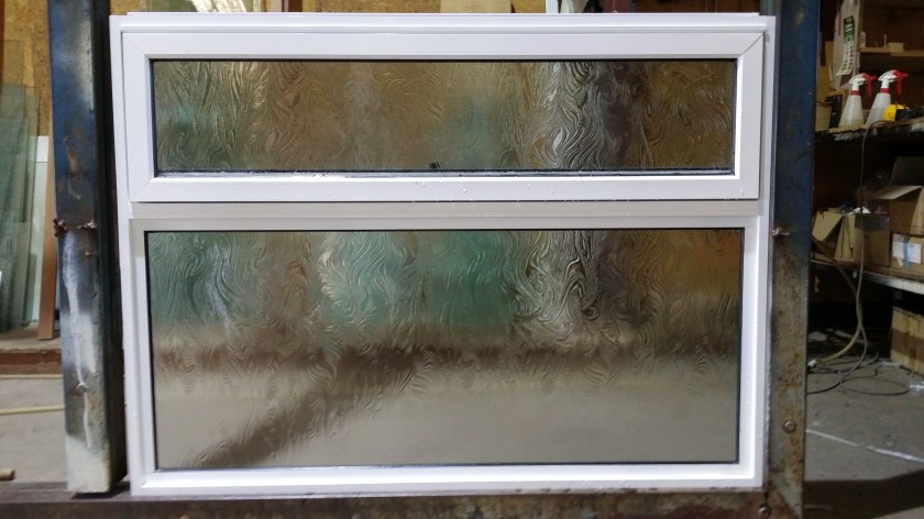 White Aluminium awning window. Domestic frame. TAFFETA toughened glass